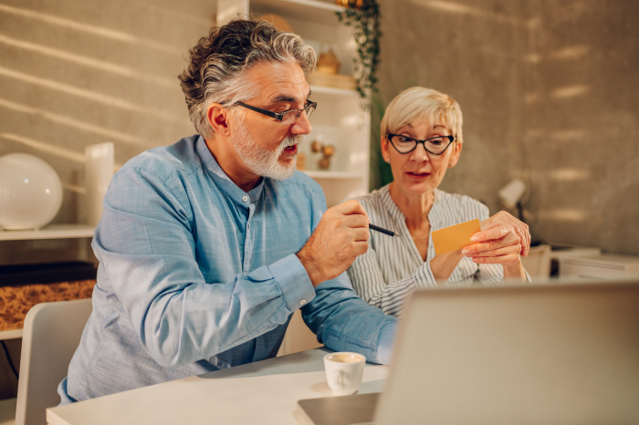 a senior couple setting up their checking account in plaquemine